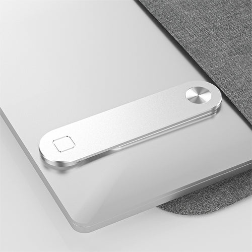 Phone mount folded flat on the back of a laptop lid