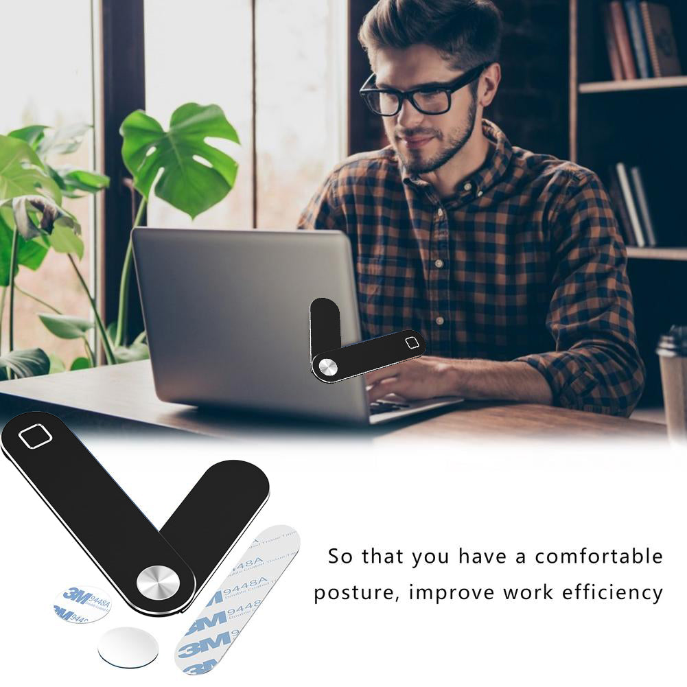 Black phone mount on a laptop in a home office